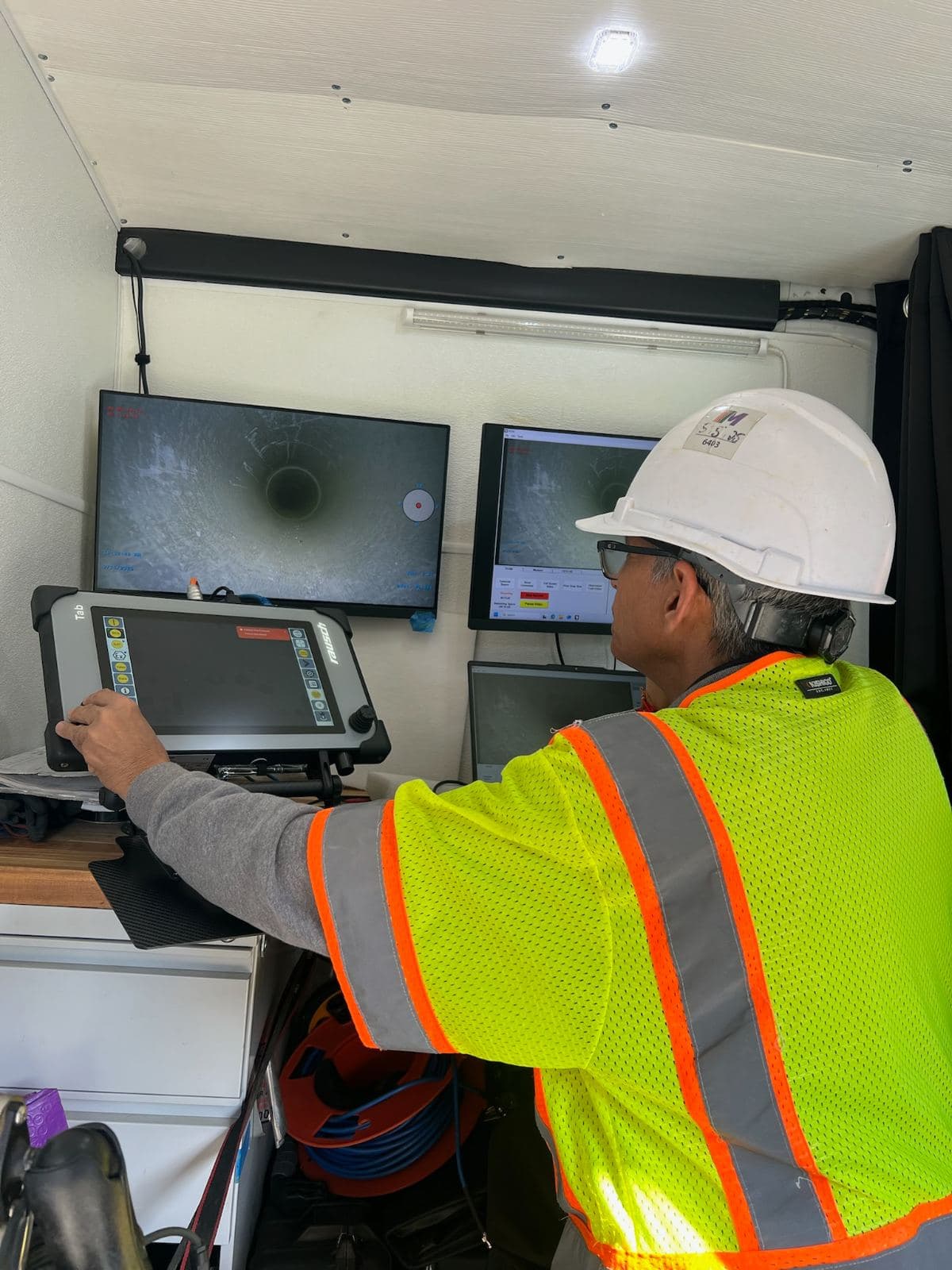 CCTV inspection truck console reviewing pipeline footage