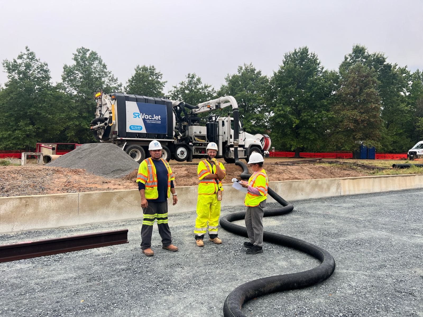 SRVacJet operator at a vac truck on a job site