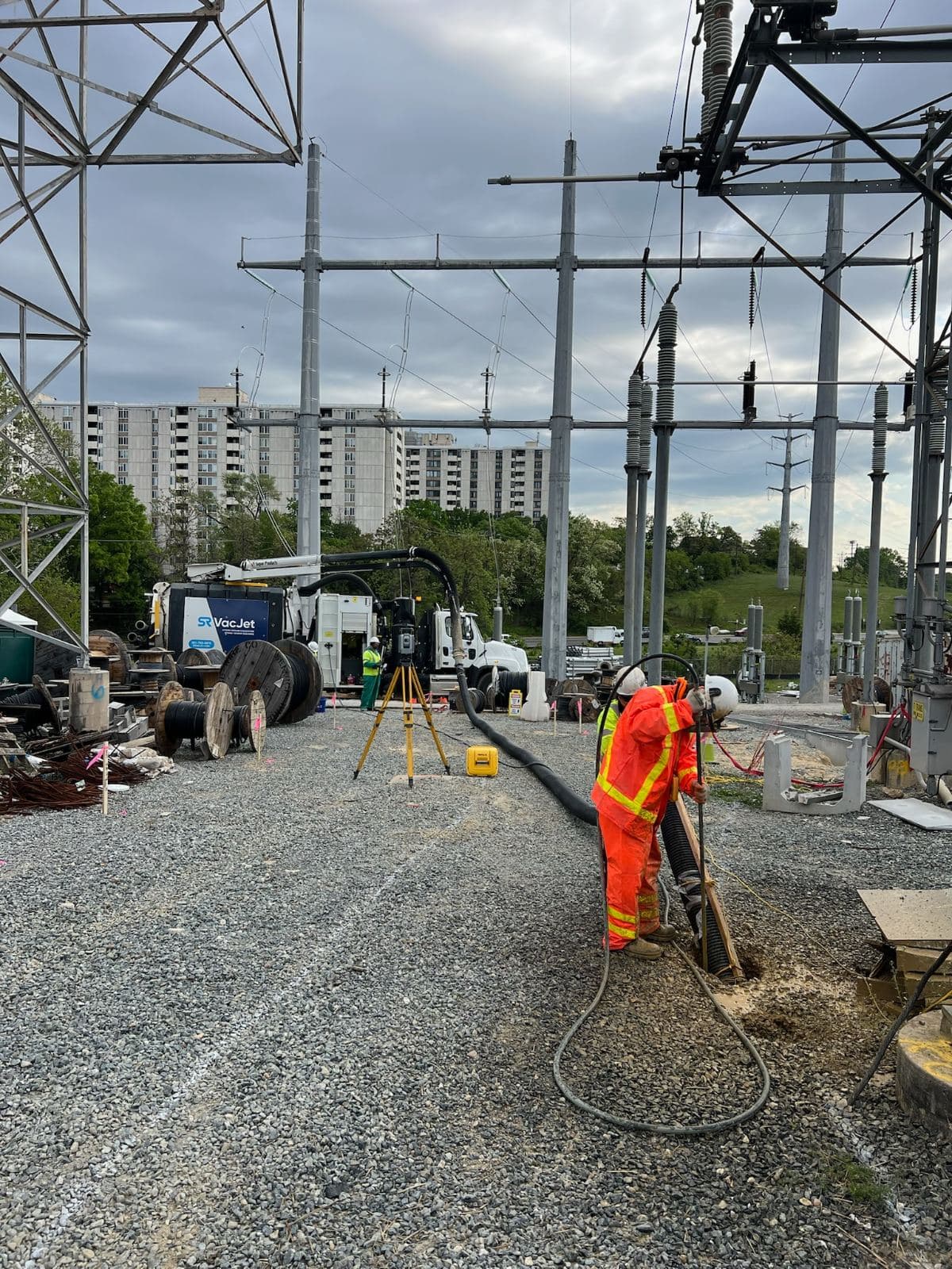 Hydrovac boom over an open excavation at a substation